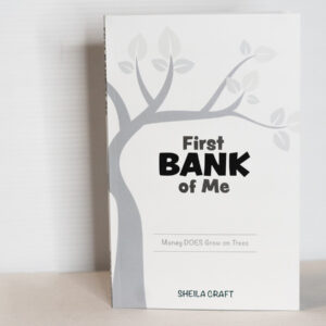 'First Bank of Me' book cover, featuring a clean white background with a grey tree and the title, along with the quote 'Money does grow on trees.'